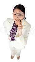 businesswoman holding a magnifying glass