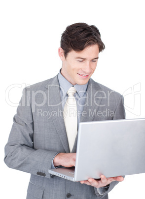 Positive businessman using a laptop