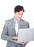Positive businessman using a laptop