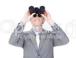 businessman looking up through binoculars