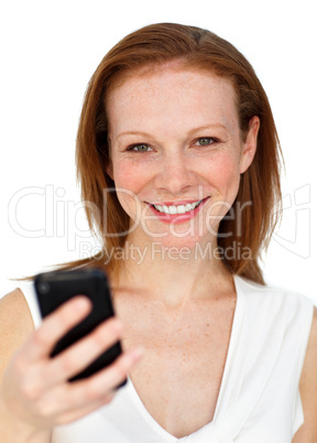 Attractive businesswoman sending a text