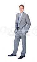 businessman standing with hands in pockets