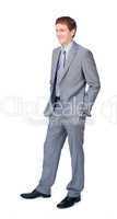 businessman standing with hands in pockets