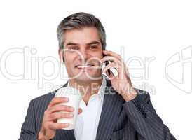Businessman on phone drinking coffee