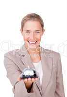 businesswoman holding a bell