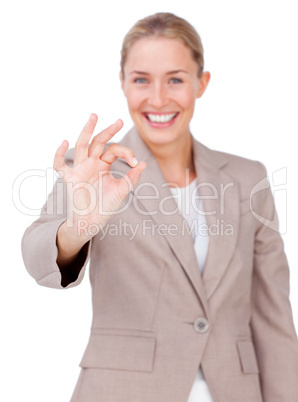 Positive businesswoman showing OK sign