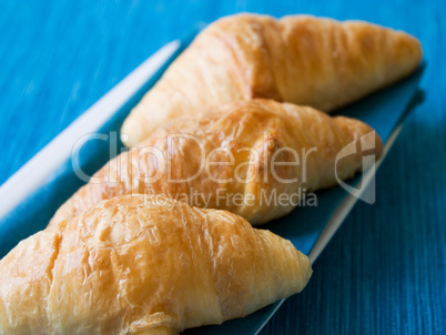 Croissant with blue background