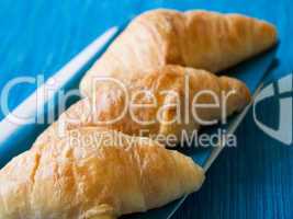 Croissant with blue background