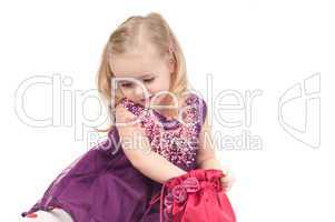 Studio shot of baby girl in gala dress