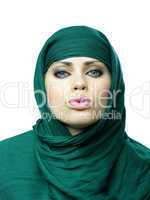 beautiful woman in a green linen cape