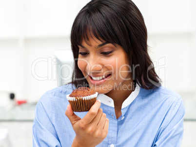 businesswoman eating a muffin