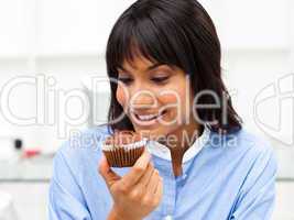 businesswoman eating a muffin