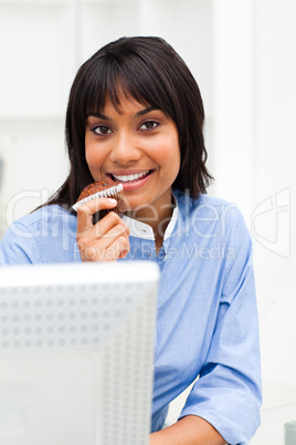 businesswoman eating a muffin