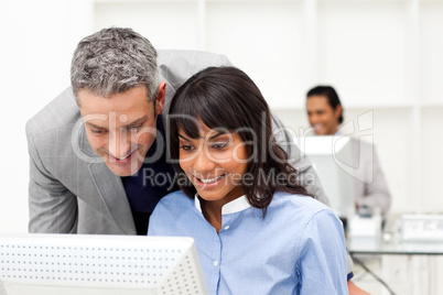 Manager checking his employee's work