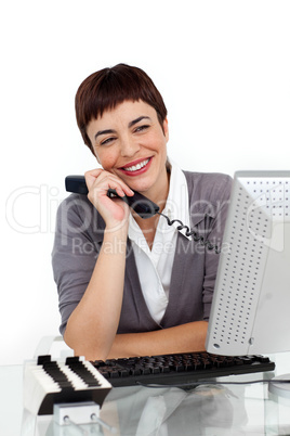 Businesswoman holding a telephone