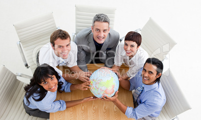 business people holding a globe