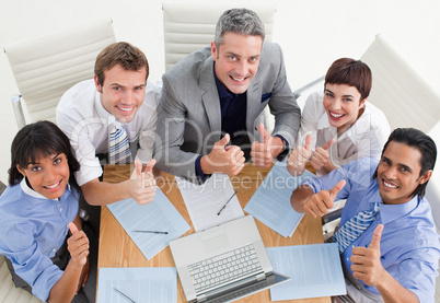 business team with thumbs up