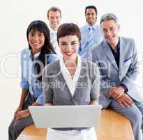 Enthusiastic business people using a laptop