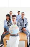 Multi-ethnic business people holding a terrestrial globe