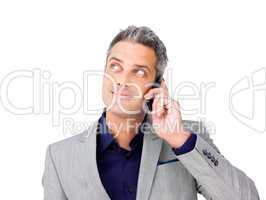 Businessman on phone looking up