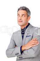 Businessman with folded arms looking up