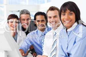 Multi-ethnic smiling business team