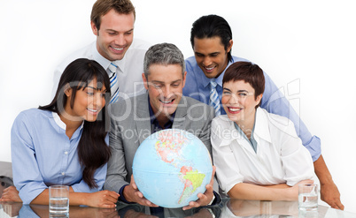 business partners holding a globe