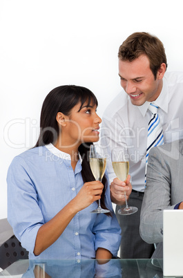 Two colleagues toasting with Champagne