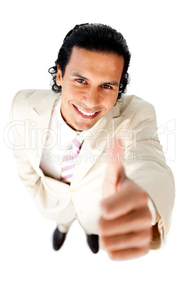 Smiling young businessman with thumb up