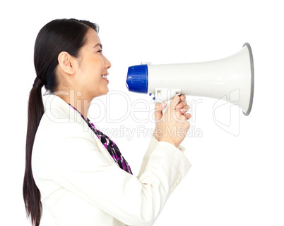 Smiling businesswoman using a megaphone