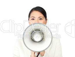 Young businesswoman shouting through a megaphone