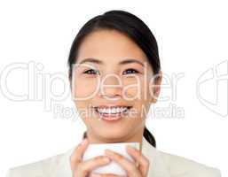 Laughing businesswoman drinking coffee