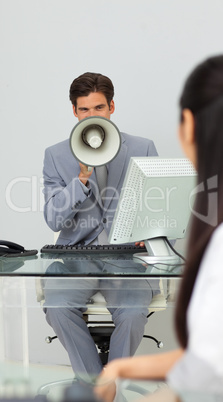 Businessman giving instructions with a megaphone