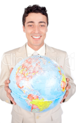 Assertive male executive holding a terrestrial globe