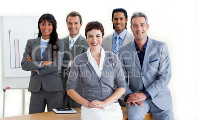 Confident multi-ethnic business people around a conference table