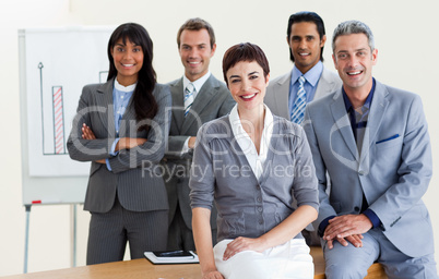 Cheerful multi-ethnic business people around a conference table