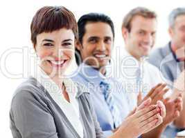 A diverse business group clapping a good presentation
