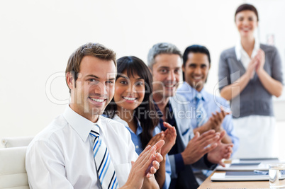 International business partners applauding a good presentation