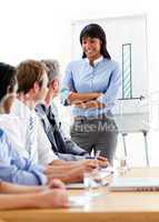 Self-assured businesswoman presenting to her team