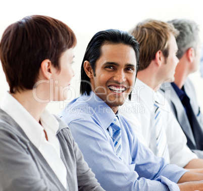 International business people sitting in a row