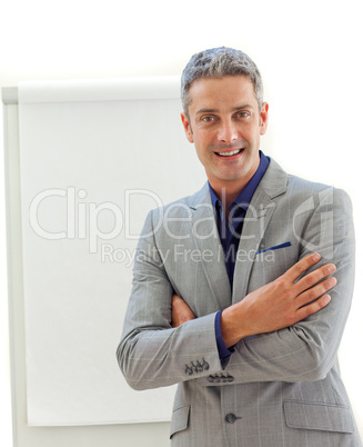Mature businessman in front of a board