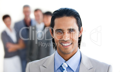 Charismatic businessman in front of his team