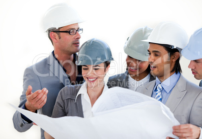 International engineers studying a construction plan