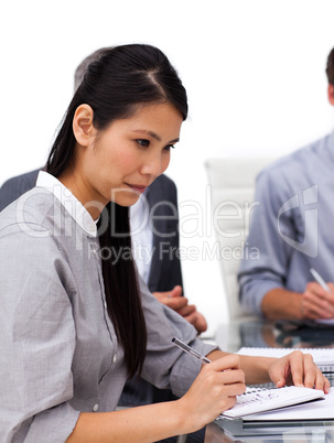 Concentrated female executive studying a document