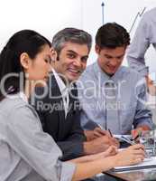 Multi-ethnic business co-workers in a meeting