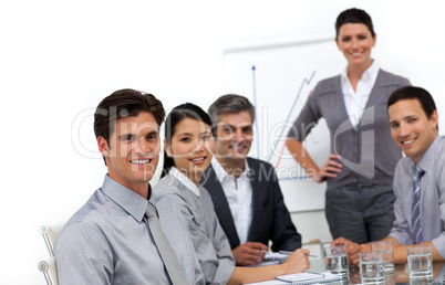 Smiling international business people at a presentation