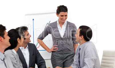 Confident manager presenting to her team