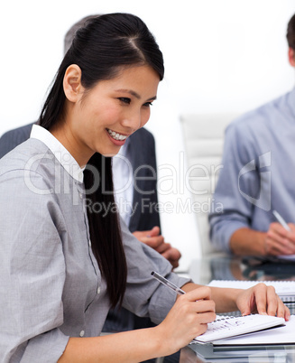 Happy female executive studying a document