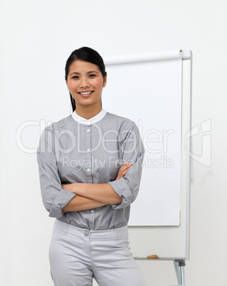 Self-assured asian businesswoman with folded arms