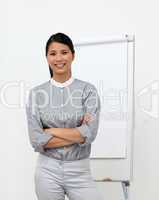 Self-assured asian businesswoman with folded arms